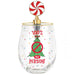 A clear stemless wine glass with a festive holiday design featuring a green Christmas tree, red text reading '100% that PERSON!', and colorful confetti dots. The glass is topped with a gold-finished collar and an enamel pin shaped like a red and white swirled lollipop.