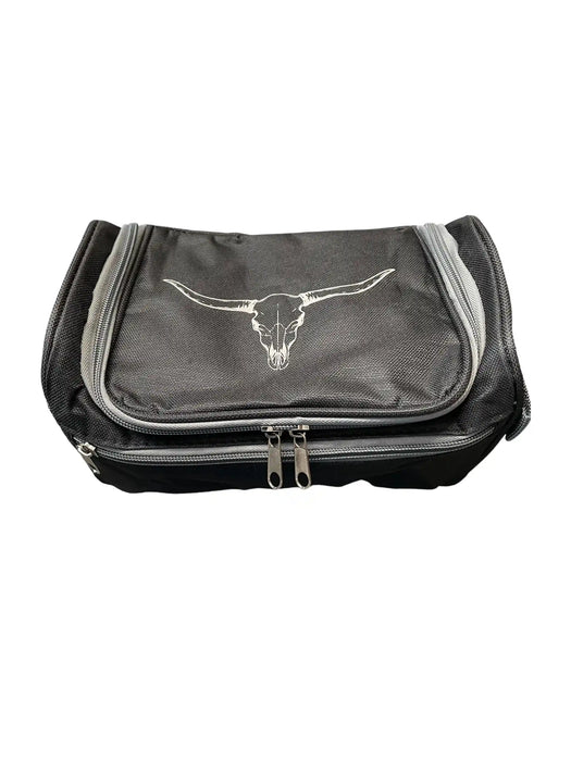 A black zippered toiletry bag featuring a white longhorn steer skull logo on the front pocket, set against a plain white background.