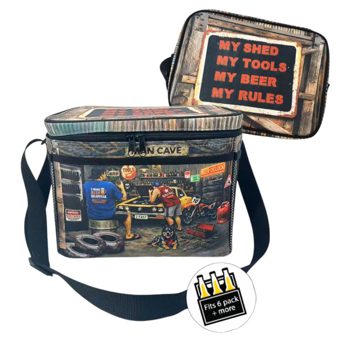 A rectangular soft-sided cooler bag with a black shoulder strap, shown closed from the front and open from the back on a white background. The front features a vintage-style garage scene with a car, tools, and signs, including a 'GIAN CAVE' label.