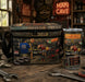 A branded cooler bag and matching tumbler set displayed on a rustic workbench in a garage-themed setting. The products feature a detailed 'Man Cave' graphic with a car, motorcycle, tools, and characters, along with the text 'MAN CAVE' and 'BEER O' CLOCK'.