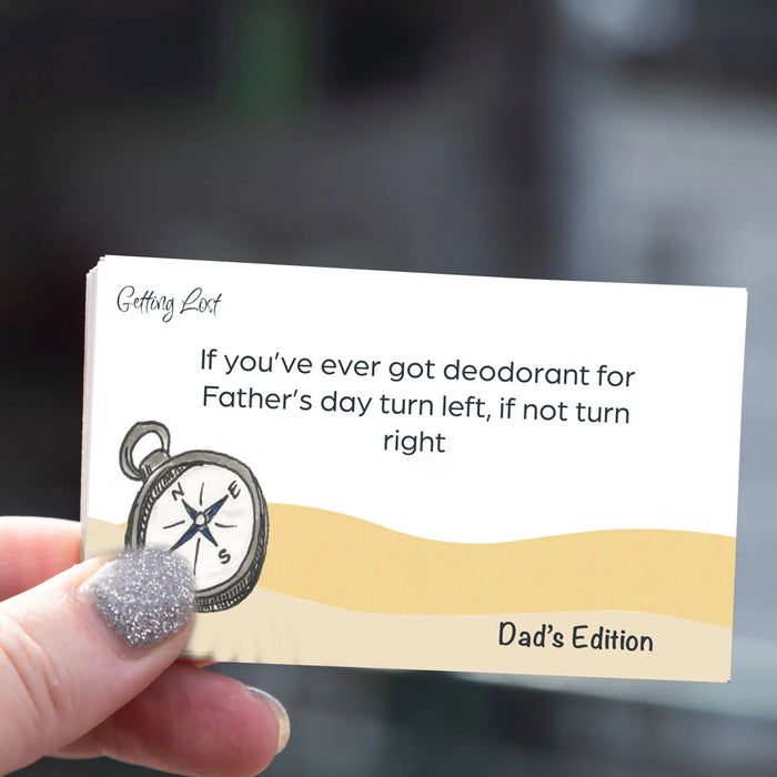 Card with humorous message about Father's Day deodorant, held by a hand.