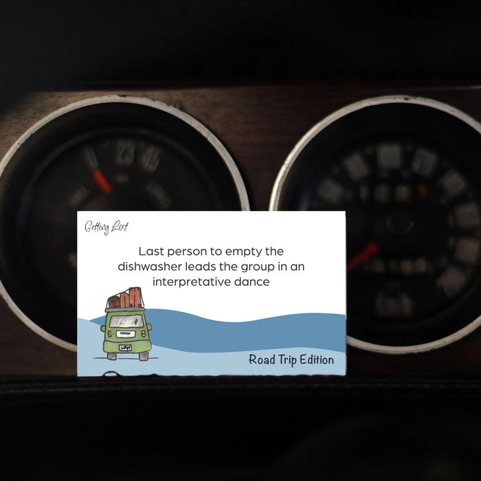 Cartoon card with humorous text about a road trip on a car dashboard with gauges.