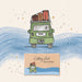 A watercolor-style illustration of a green van carrying orange and brown luggage on its roof, with the words 'Getting Lost Road Trip Edition' printed on a small card below. The artwork is set against a cream background with blue waves and small gold star-like accents.