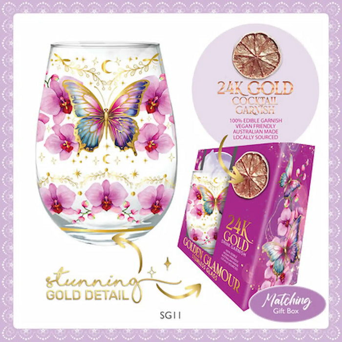 A clear stemless wine glass decorated with pink orchids, a blue and purple butterfly, gold crescent moons, and gold glitter details, shown next to a matching purple gift box labeled '24K Gold Cocktail Garnish'. The image includes promotional text and decorative borders.