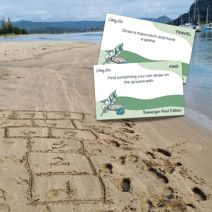 Two cards on a beach with a scenic background