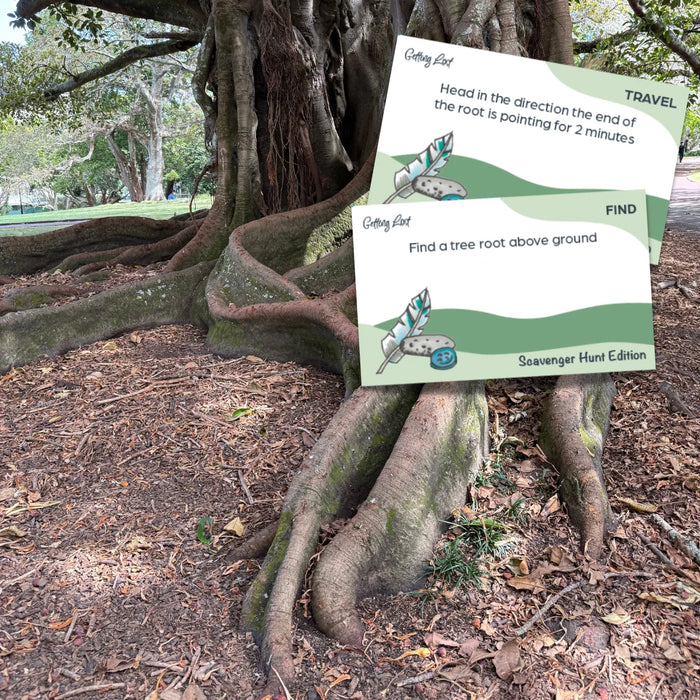 Tree root with a scavenger hunt card attached in a park setting