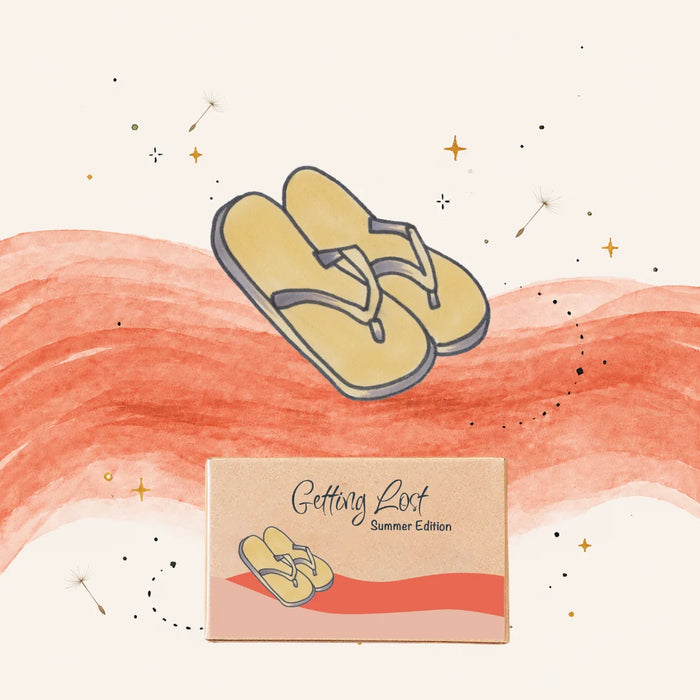 A stylized illustrated product graphic showing a pair of yellow flip-flops above a small box labeled 'Getting Lost Summer Edition' on a cream background with coral brushstrokes and small star/dandelion doodles.