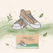 Illustration of a brown sneaker with a matching box on a green background