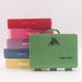 A stack of colorful hard plastic storage cases with handles, featuring a green front case printed with 'Getting Lost' and 'Walkers Edition' alongside a shoe graphic, set against a plain white background.