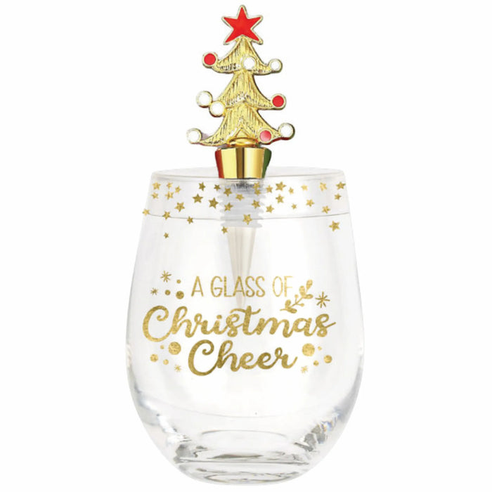 A clear stemless wine glass with gold glitter and the words 'A DANCING Christmas Cheer' printed on it, topped with a small gold Christmas tree and red star against a plain white background.