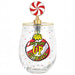A clear stemless wine glass with a gold rim, decorated with colorful confetti dots and a large red, yellow, and black graphic that reads 'BOTTOMS UP GRINCHES' with a nutcracker illustration. It is topped with a gold-finished candy corkscrew featuring a red and white swirl lollipop on a white background.