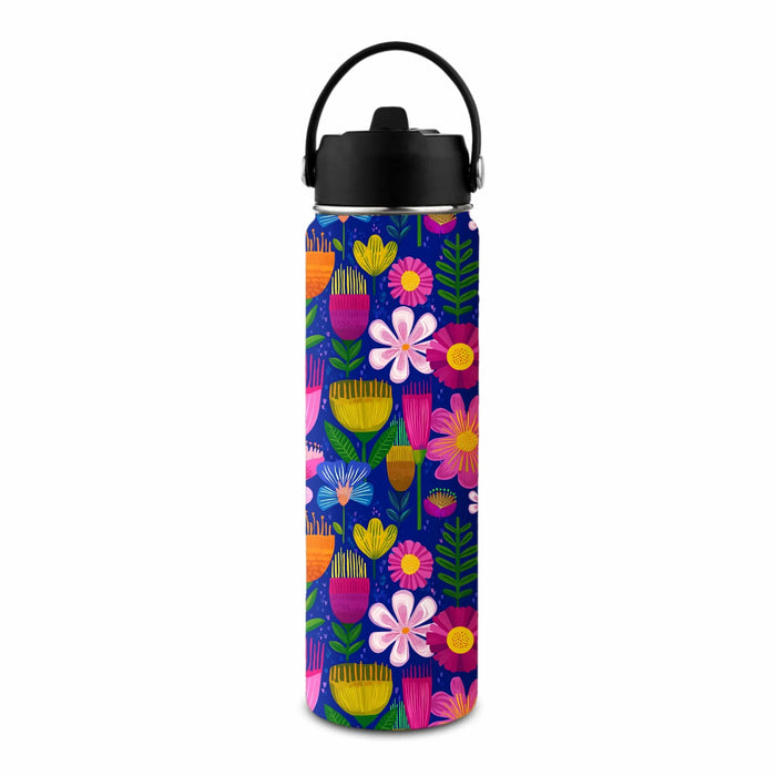 A reusable insulated water bottle with a black lid and handle, featuring a vibrant multicolor floral pattern on a dark blue background.