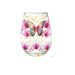 A clear stemless wine glass decorated with a colorful butterfly, pink orchids, gold crescent moons, and stars on a white background.
