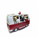 A festive ceramic planter shaped like a red and white vintage camper van, filled with animal characters wearing Santa hats and suits, with a small Santa figure on top, set against a plain white background.