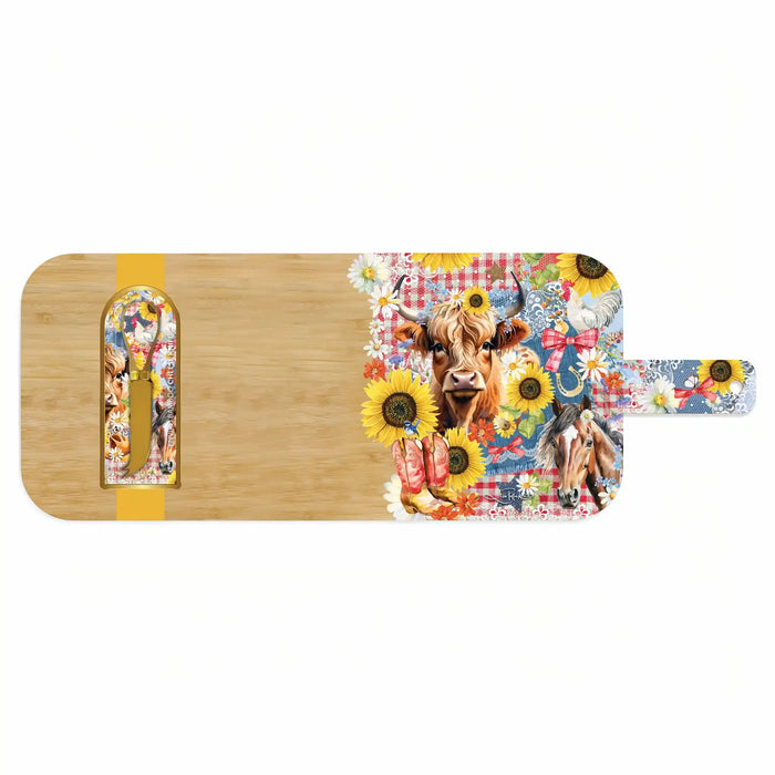 A rectangular wooden serving board with a colorful printed floral and animal design on the right side and handle, plus a yellow stripe accent on the left side, shown on a plain white background.