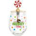 A clear stemless wine glass with a gold rim and a festive holiday-themed lollipop topper. The glass features colorful polka dots and the text 'FEELING GRINCHY EXTRA GRINCHY TODAY' in green and red, with a small ornament charm hanging from the topper.