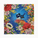 A square fabric napkin or coaster with a scalloped edge, featuring a vibrant tropical floral border and a blue-and-white bird on a rich blue background.