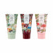 Three tubes of hand cream from The Little Bee 'In the Garden' line, shown side by side on a white background. The tubes feature whimsical garden gnome illustrations with different color palettes: sage green, deep burgundy, and light pink, decorated with leaves, mushrooms, and flowers.