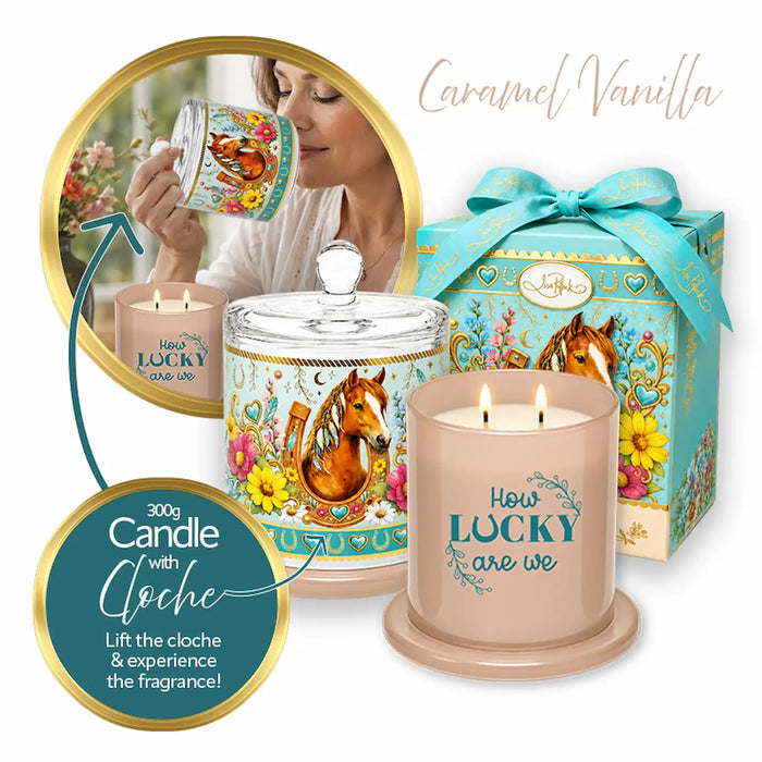 A decorative candle set with a beige candle in front, a matching lidded jar behind it, and a turquoise gift box with a horse illustration. The packaging and labels feature a horse, floral motifs, and the text 'How Lucky Are We' and 'Caramel Vanilla.