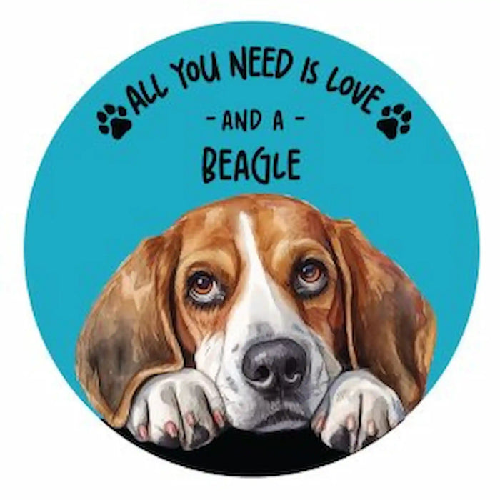 A circular coaster featuring a painted beagle dog with the text 'ALL YOU NEED IS LOVE - AND A BEAGLE' and black paw prints on a bright blue background.