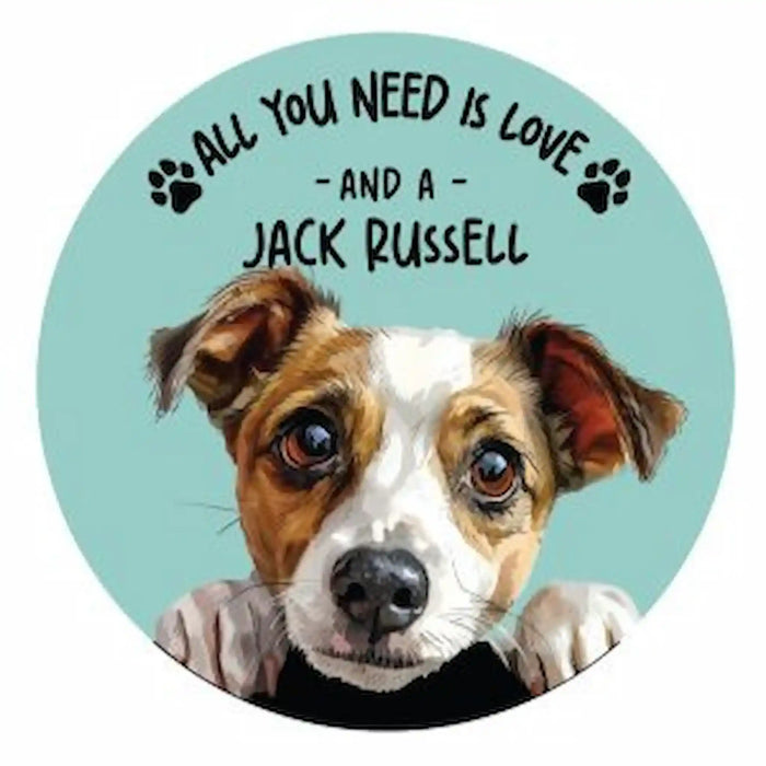A circular coaster featuring a painted Jack Russell dog head on a light aqua background with the text 'ALL YOU NEED IS LOVE - AND A - JACK RUSSELL' and small paw prints.