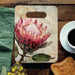 Great Southern Lands ceramic server with pink king protea design styled on a wooden table beside coffee and toast