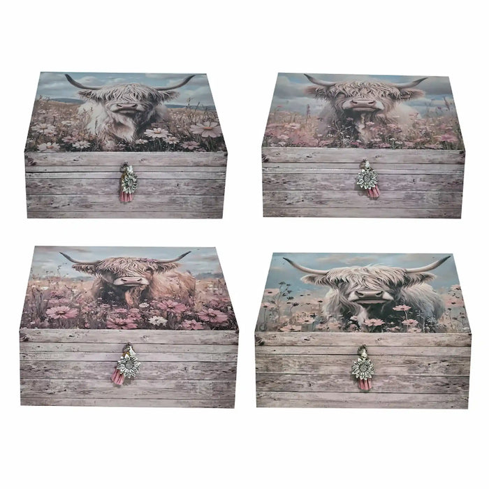 Set of four decorative storage boxes with a rustic weathered wood finish, featuring a Highland cow illustration on the lid and a small floral clasp on the front, shown against a plain white background.