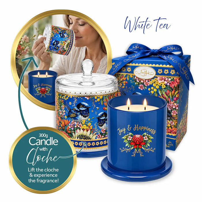 Blue tea-themed scented candle set with a glass jar candle, a matching blue candle holder, and a decorative gift box, all decorated with floral and butterfly motifs. The image includes promotional text reading 'White Tea' and '300g Candle with Cloche' on a clean white background.