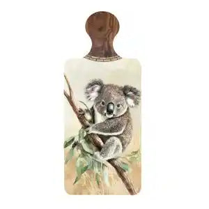 A rectangular wooden cutting board with a rounded top handle, featuring a printed illustration of a koala sitting on a eucalyptus branch. The board has a light beige background and is shown against a plain white background.