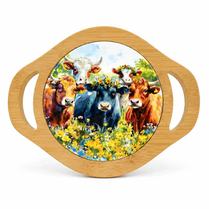 A round bamboo serving tray with two side handles and a colorful printed illustration of five cows in a flower field, shown on a white background.