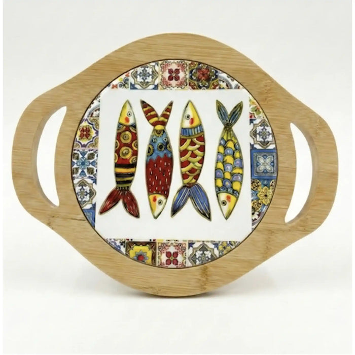 A round wooden serving board with two side handles and a central white panel featuring four colorful fish illustrations surrounded by a patterned border.