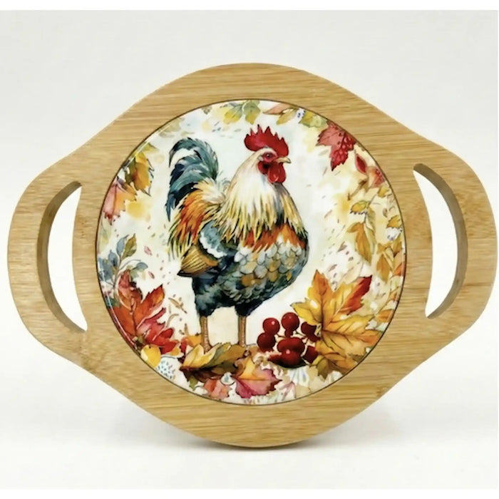 A round decorative serving tray with a light natural wood rim and two side handles, featuring a printed illustration of a rooster surrounded by autumn leaves and berries on a cream background.