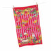 A festive Christmas tea towel with a red and pink striped background, decorated with stockings, ornaments, a nutcracker, cakes, and the word 'Cheers' repeated across the front. The towel is shown hanging from a clothesline with wooden clothespins against a plain white background.