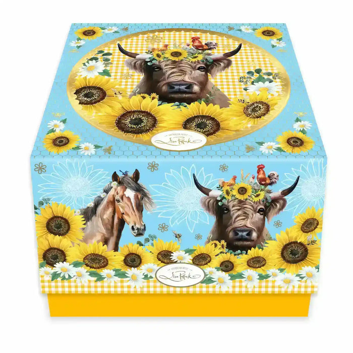 Lisa Pollock Country Collection gift box for the ceramic tea cup, decorated with a highland cow wearing a sunflower crown, a horse, roosters, sunflowers and daisies on a sky blue gingham background with a yellow base