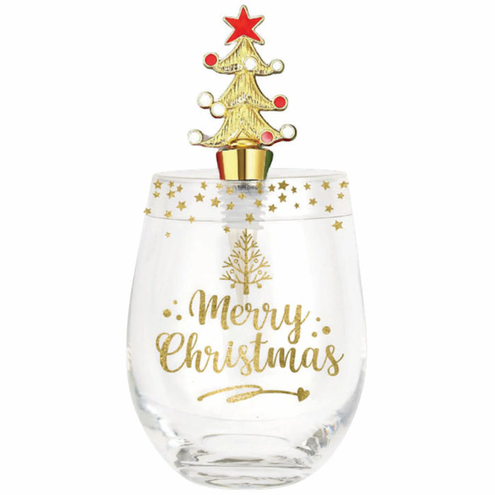 A clear stemless wine glass with gold 'Merry Christmas' lettering and a gold tree design, topped with a gold Christmas tree ornament featuring a red star and red ornaments, on a white background.