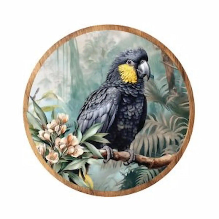 Midnight Australiana ceramic trivet featuring a black cockatoo with a yellow cheek patch among native foliage. 