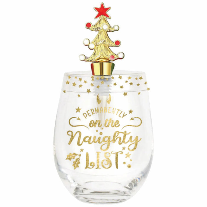 A clear glass wine glass with gold lettering that reads 'Merry Merry Naughty Night' and a gold Christmas tree-shaped stopper with a red star, shown on a plain white background.