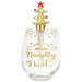 A clear glass wine glass with gold lettering that reads 'Merry Merry Naughty Night' and a gold Christmas tree-shaped stopper with a red star, shown on a plain white background.