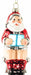 Santa on toilet novelty glass Christmas ornament reading a blue book, front view on a white background