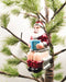Santa on toilet novelty glass Christmas ornament with red suit and boots, hanging on a tree