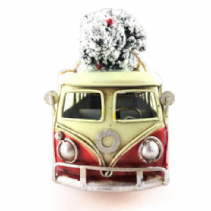 A vintage-style Christmas ornament shaped like a cream and red Volkswagen Type II van with a snow-covered tree on its roof, shown on a plain white background.