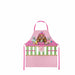 A pink apron with a cartoon cat character, a gingham check pattern, and green decorative accents, shown against a plain white background.